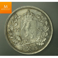 Sjelden! 12 skilling 1862 kvalitet 01, svært god histrikk på mynten solgt på Oslo Myntgalleri